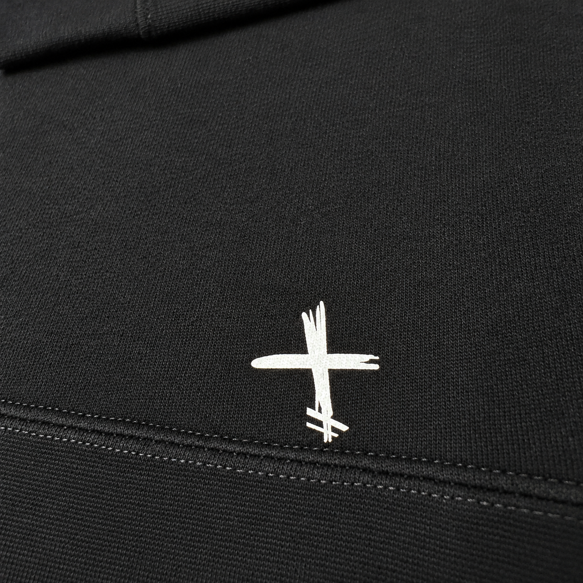 Close-up of hem with white brushstroke marking
