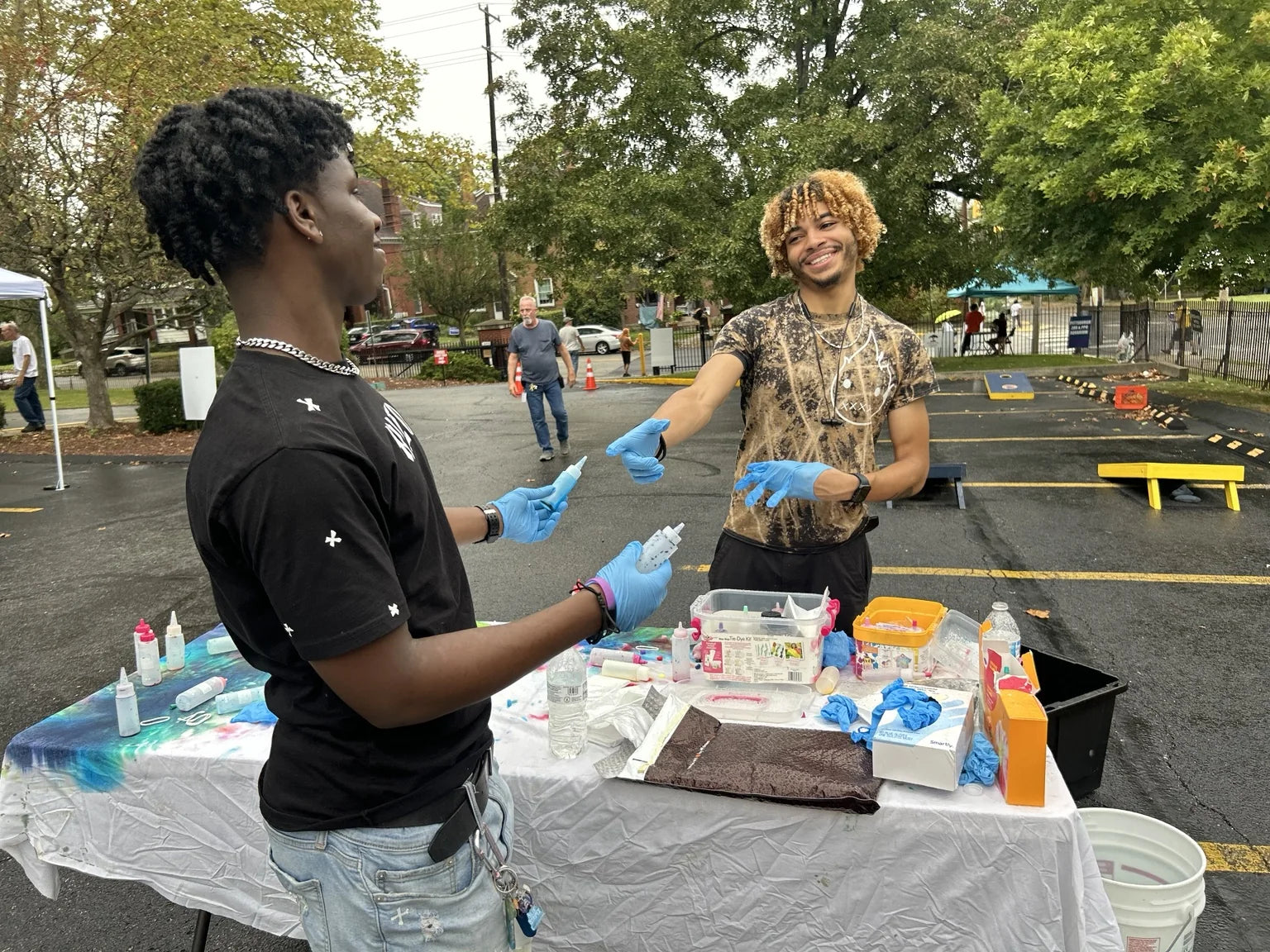 People sharing art supplies at a community creative table in Pittsburgh