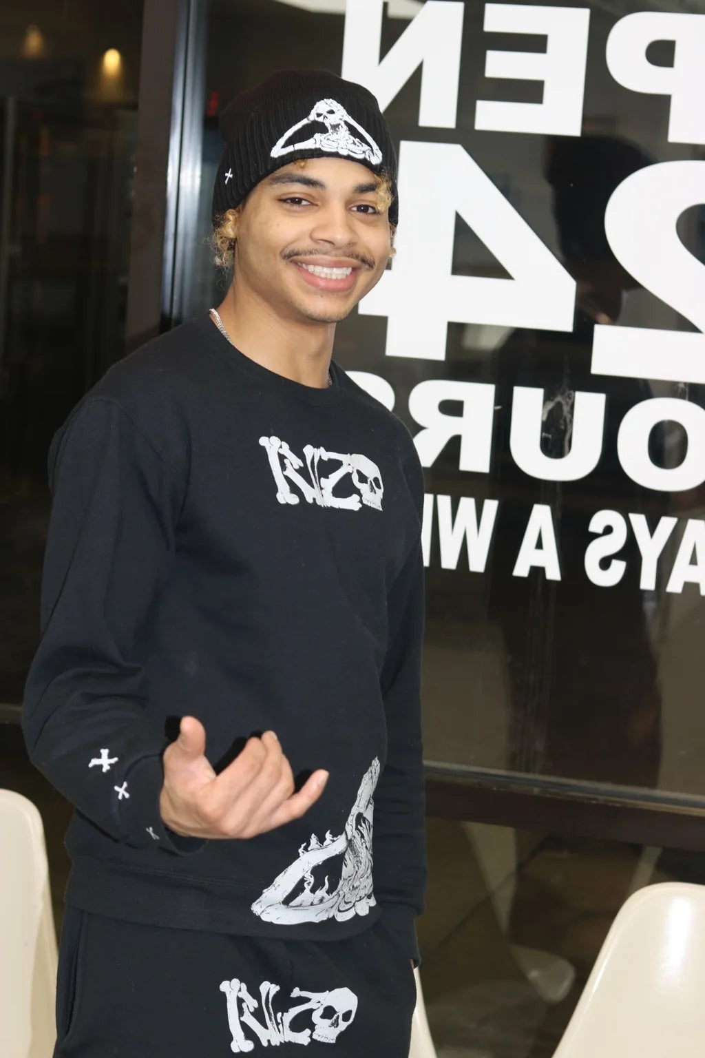 Taymar Spencer wearing a full black Rizo outfit